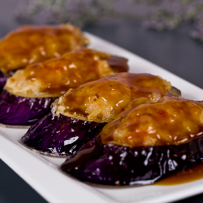 Fish paste stuffed eggplant in abalone sauce